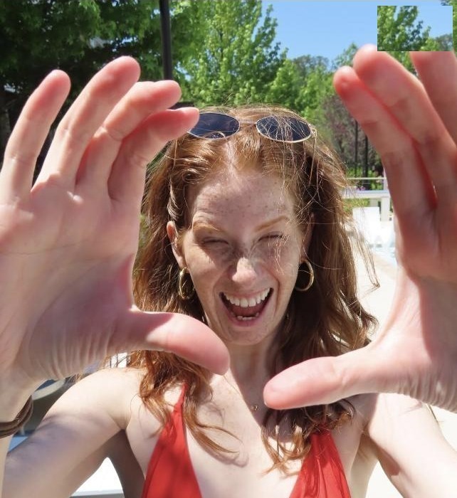 Kate Broderick smiling by the pool in North Carolina.